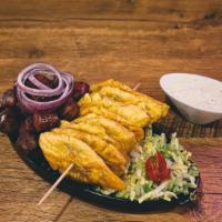 Longaniza Con Tostones · Fried Dominican-style pork sausage served with crispy golden tostones