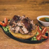 Mofongo De Pernil · Fried green plantains mashed together in a pilón with salt, our homemade broth, garlic & oli...