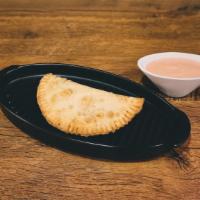 Empanada Ham And Cheese · One empanada filled with cubed ham and yellow cheese