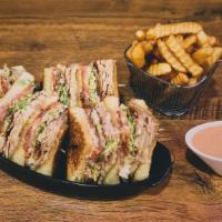 Turkey Club Sandwich · Your favorite traditional! Crispy bacon and melted Swiss cheese layered over grilled turkey ...