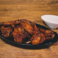 Chicken Wings (10-Piece) · Deliciously seasoned chicken wing sections fried to perfection and dressed with your favorit...