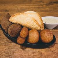 Rico Sampler · 2 of each of the following items: cheese empanadas, quipes, croquetas and yucca balls. Serve...