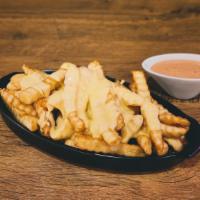 Cheese Fries · Golden crinkle-cut French fries fried to perfection & topped with melted cheese