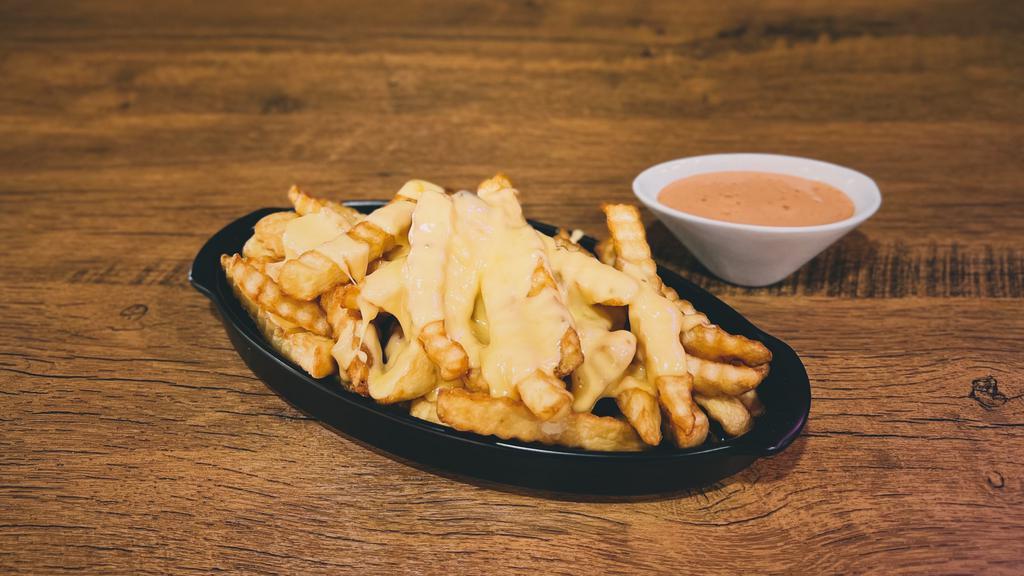 Cheese Fries · Golden crinkle-cut French fries fried to perfection & topped with melted cheese
