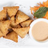 Curry Samosa · Spicy. Eight pieces. Deep-fried samosa filled with potato, onion, carrot, mushroom, and curr...