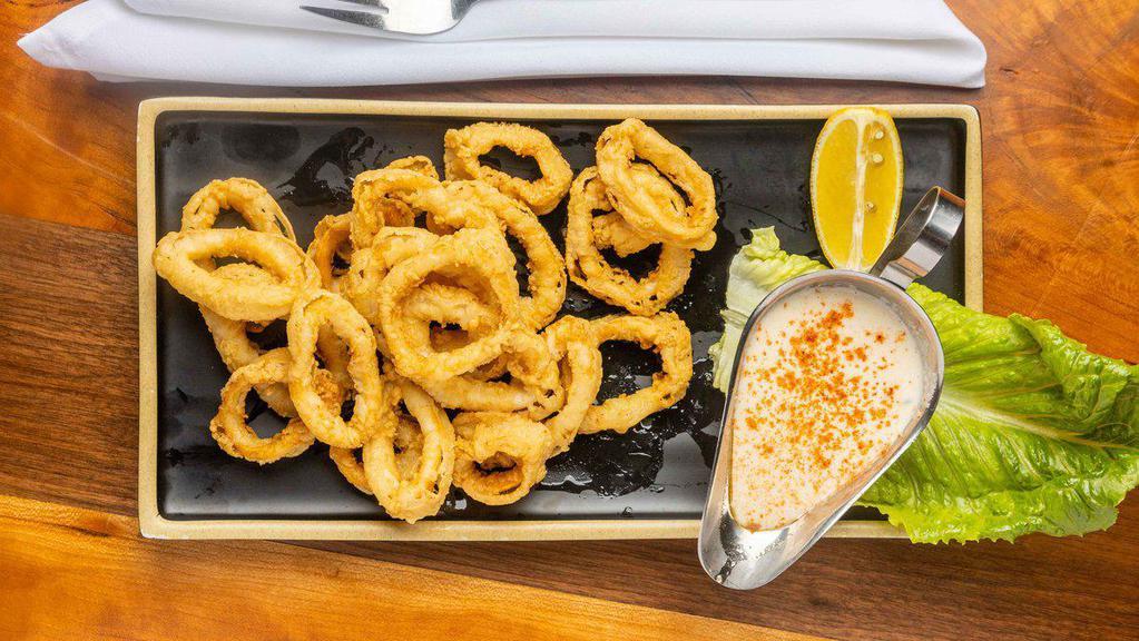 Kalamar Tava / Fried Calamari · Calamari rings lightly pan-fried and served with chef's homemade sauce.