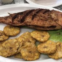 Pargo Frito · Fried red snapper. Arroz, ensalada y tostones. Rice, salad with french fries.