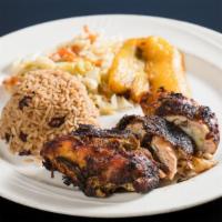 Jerk Chicken · Served with macaroni and cheese potato salad and mix greens.