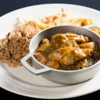 Curry Chicken · Served with macaroni and cheese potato salad and mix greens.