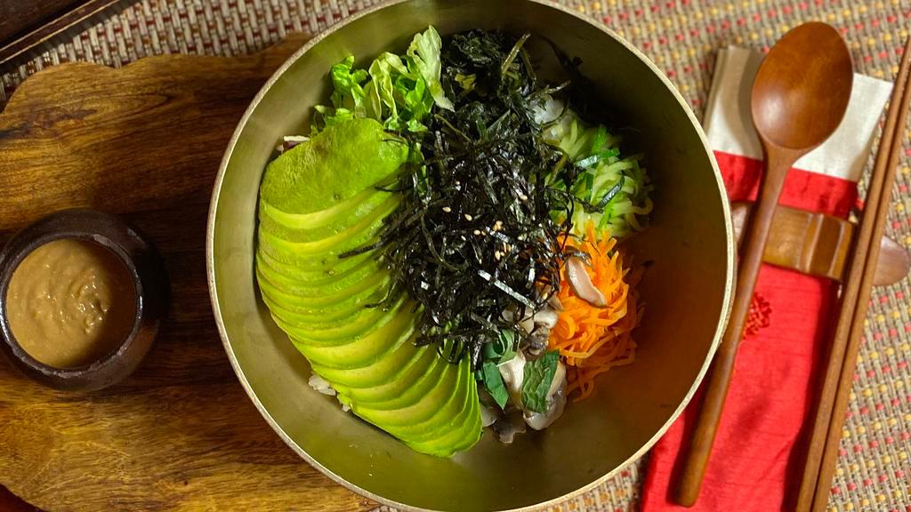 Gluten Free Avocado Bibimbap · Avocado with variety of vegetables and tofu over brown rice mixed with gluten free miso sauce.