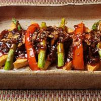 Tofu Steak · Crispy tofu with asparagus, bell peppers, mushrooms and special steak sauce.