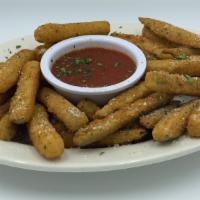 Fried Zucchini Sticks · Fried Zucchini Sticks topped with grated Romano & fresh parsley.  Served w/ a choice of Ranc...