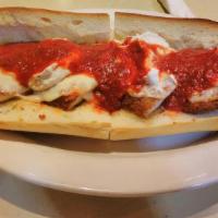 Chicken Parmigiana · Fried Chicken Cutlet topped w/ Mozzarella & Tomato sauce on a toasted Italian hero.