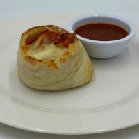 Pinwheels · Choice of Pepperoni & Ham OR Spinach & Broccoli.  Served w/ a side of Tomato Sauce.