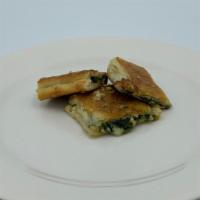 Spinach & Mozzarella Chips (3 Pcs) · Flat pizza dough chips filled with spinach & mozzarella.  Topped with garlic, olive oil, gra...