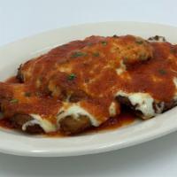Veal Parmigiana · Fried Veal Cutlets Topped w/ Mozzarella & Tomato Sauce.