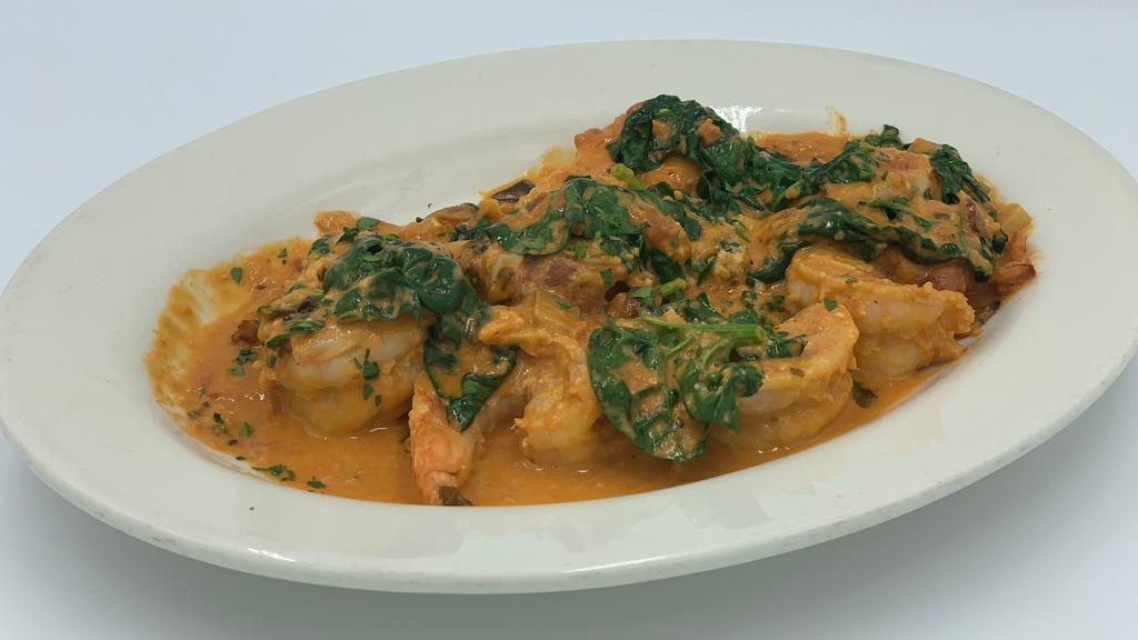 Shrimp Alla Mario · Spinach or broccoli and garlic in a tomato sauce with a touch of cream.