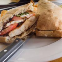Lebanese Sandwich · Grilled chicken with lettuce, tomatoes, and Lebanese sauce.