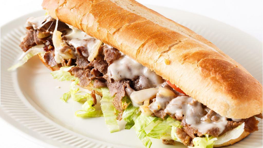 Philly Cheese Steak Sandwich · Delicious steak with cheese, peppers, onions, lettuce, tomatoes and mayonnaise.