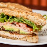 Turkey Club Sandwich · Fresh turkey breast with bacon, American cheese, lettuce, tomatoes and mayonnaise.