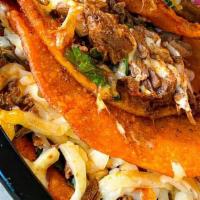 Tacos De Birria With Cheese
 · Mexican beef stew tacos, with melty cheese.