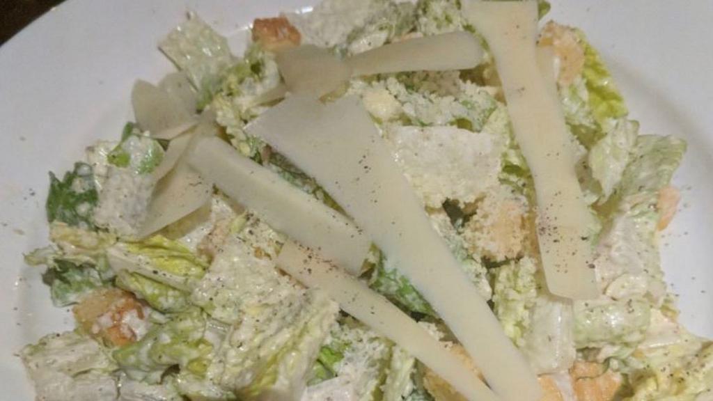 Classic Caesar Salad · Vegetarian. With shaved parmigiano cheese.