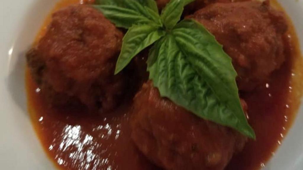 Polpettine Della Mamma (Meatballs) · Homemade beef meatballs in a tomato sauce.