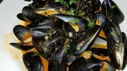 Mussels Fra Diavolo · Spicy. Gluten free. Mussels in a spicy tomato sauce.