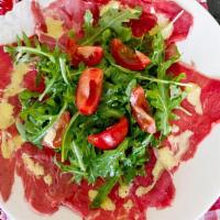 Beef Carpaccio · Gluten free. thin sliced rare beef w arugula and shaved parmesan .