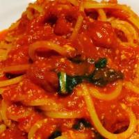 Spaghetti Al Pomodoro · Vegetarian. Spaghetti in a tomato sauce topped with Basil.