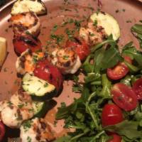 Gamberi Spiedino (Prawns On A Skewer) · Gluten free. Grilled shrimp & vegetables skewer served with an arugula &  cherry tomato salad.