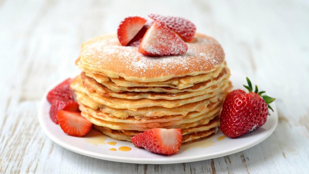 The Strawberry Pancakes · Fluffy buttermilk pancakes topped strawberries, syrup and butter.