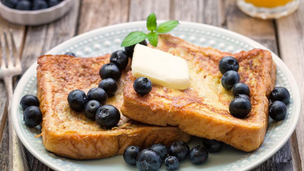 The Blueberries French Toasts · Fluffy french toasts topped blueberries, syrup and butter.