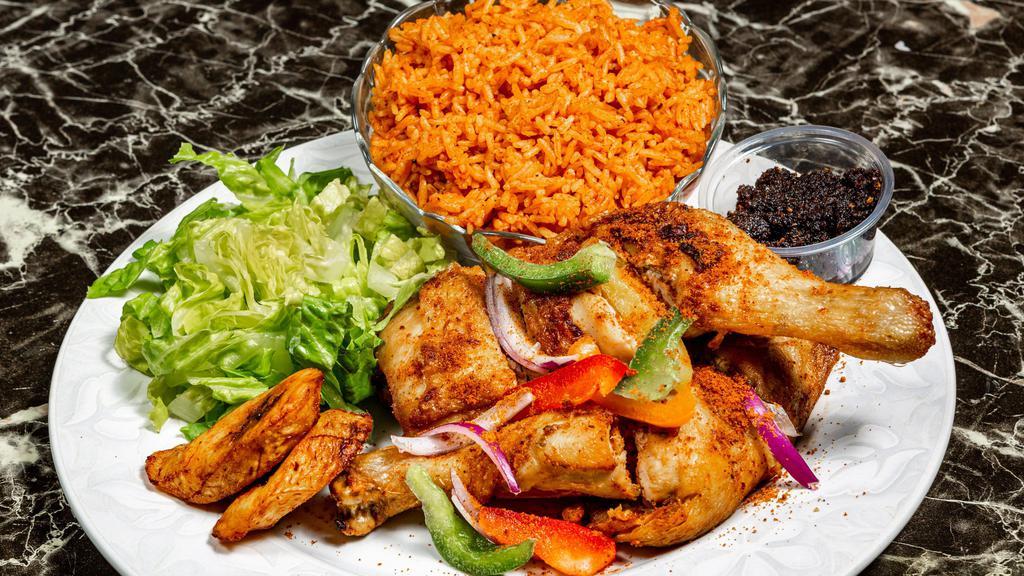 Jollof Rice · Jasmin rice cooked in spiced tomato sauce served with garden salad, sweet plantain and black pepper sauce.
