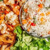 Fried Rice · Carrots, sweet peas, onions served garden salad, sweet plantain and black pepper sauce.