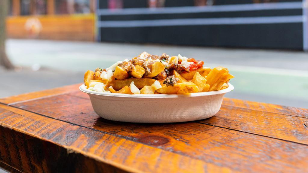Poutine Special - Regular · 16oz - Canadian curd cheddar cheese and gravy + Savory wild mushrooms, roasted garlic in olive oil, Turkish sun-dried tomatoes, topped with parmesan & fresh herbs