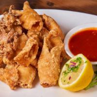 Flash Fried Calamari · Served with our legendary marinara sauce.