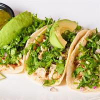 Chicken Tacos · Filled with spicy grilled chicken, avocado, salsa verde, onion, cilantro and lime.