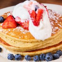 Strawberries & Cream Pancakes · Fresh strawberries, whipped cream topped with powdered sugar.
