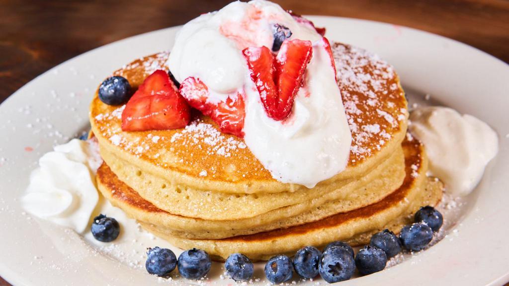 Strawberries & Cream Pancakes · Fresh strawberries, whipped cream topped with powdered sugar.