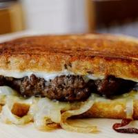 Swiss Burger Melt · Melted swiss grilled cheeseburger and sautéed onions in between.