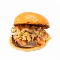 Chimi Burger · Quarter pound Angus burger with pepper jack,
repollo salad, tomato, salsa rosado, brioche bun