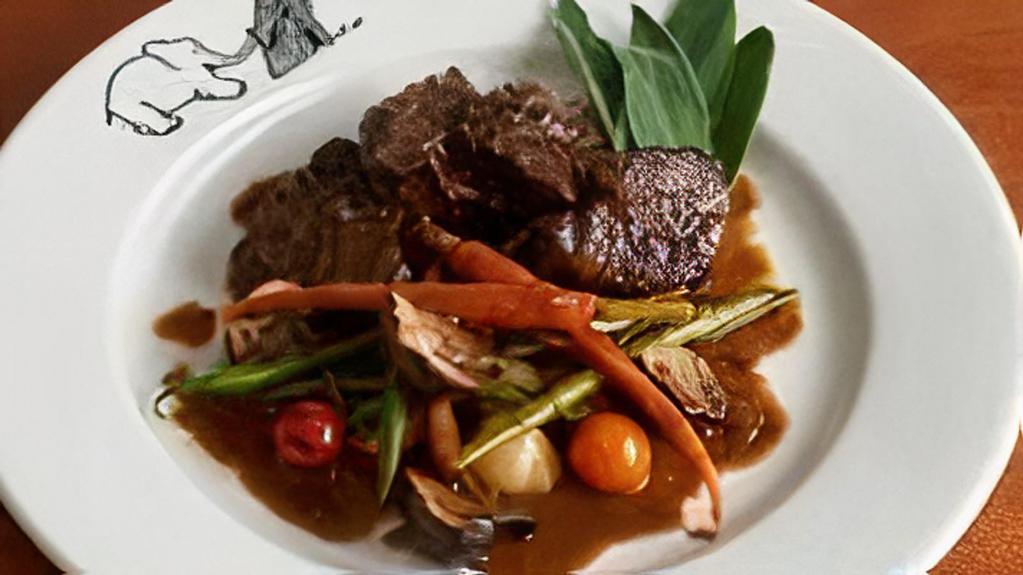 Beef Bourguignon · Pearl onions, baby carrots, mushrooms, red wine.