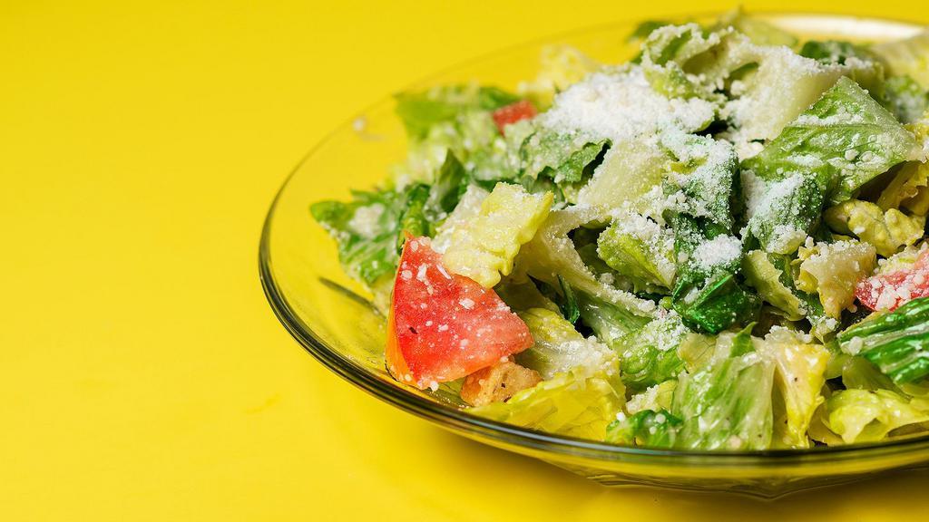 Caesar Salad · Chopped romaine, Caesar dressing, croutons, Parmesan, and tomatoes.