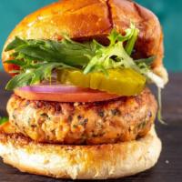 Crab Cake Burger · Seasoned crab, fried in breadcrumbs topped with green peppers and onions.