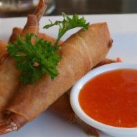 Crispy Shrimp Roll · Deep fried wrapped shrimp with rice paper and served with plum sauce. and sweet chili dippin...