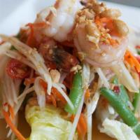 Papaya Salad With Seafood  · Green papaya, tomato, peanut and long bean in spicy lime dressing. mixed with seafood.