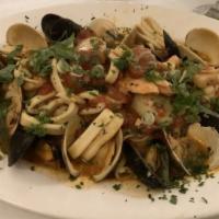 Zuppa Di Pesce · Shrimp, scallops, clams, mussels, calamari and scungili, tossed in a light marinara, fra dia...