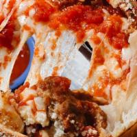 Italian Calzone · Prosciutto, salami, ham, pepperoni, ricotta, mozzarella, marinara. Side of marinara.