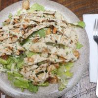 Caesar Salad · Romaine lettuce with Romano cheese, garlic herbed croutons and homemade Caesar dressing.